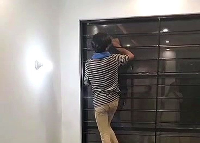 Makhdoom Services cleaning team performing window cleaning